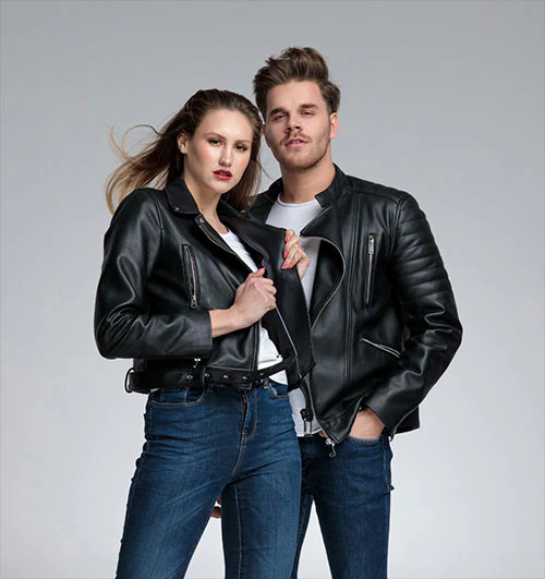 a man and a woman, both wearing a leather jacket