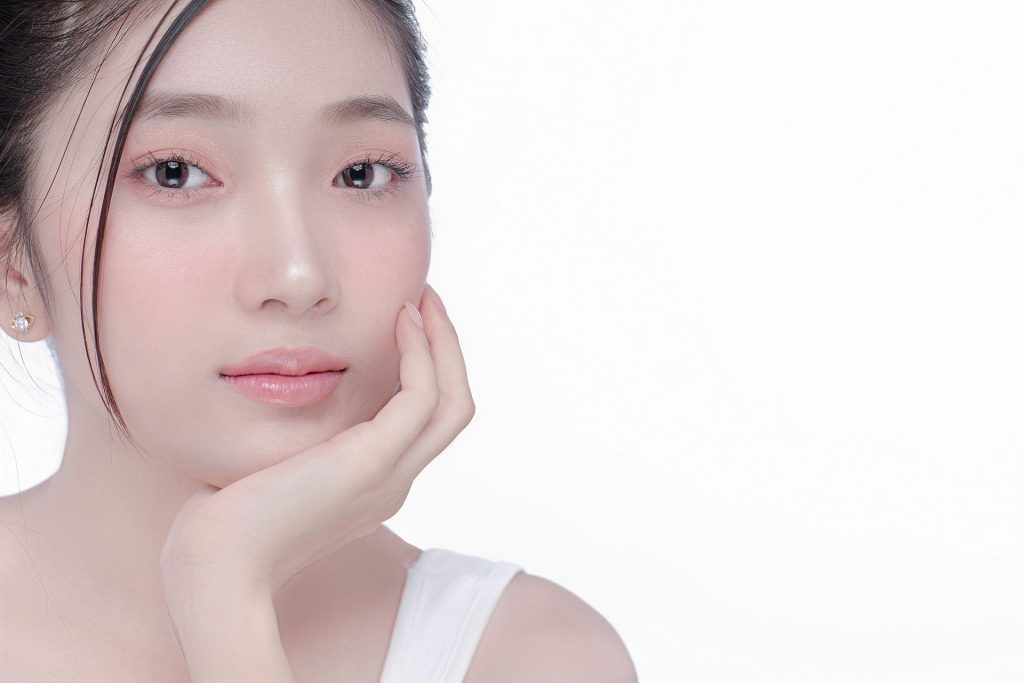 a girl who has rejuvenated her skin with skincare treatment