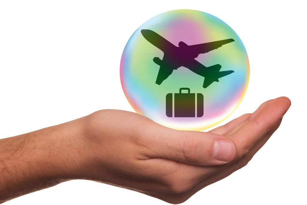 A travel insurance guide depicting an airplane and bag with travel insurance papers to show how travel insurance works