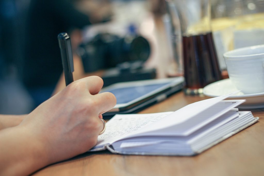 a person, who is writing a script for a video